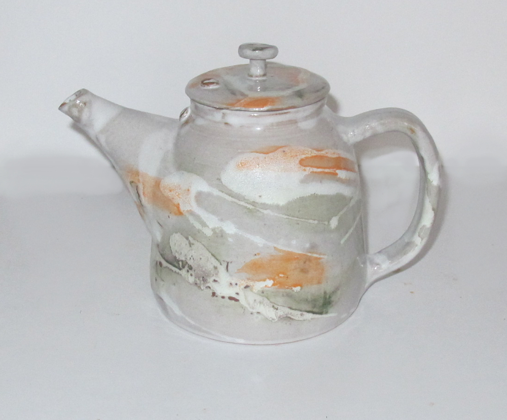 orange white tea pot